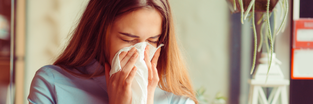 woman sneezing
